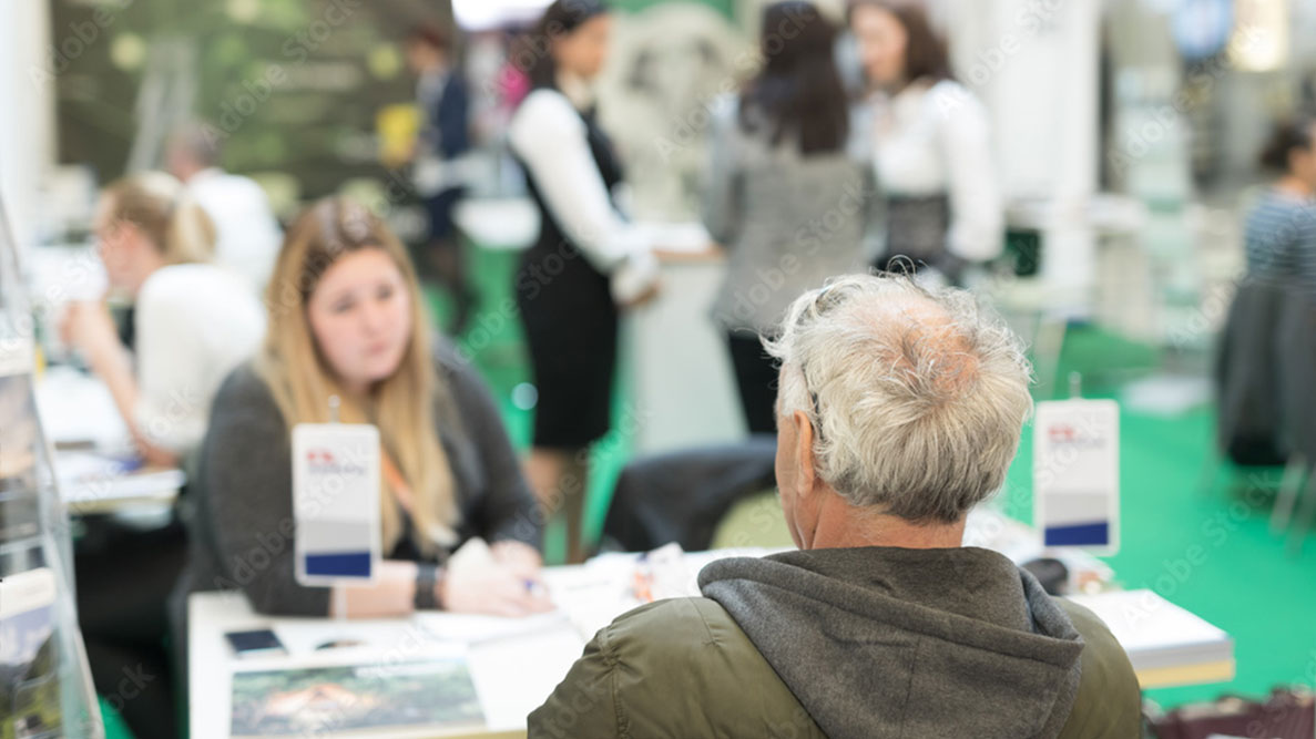 Proud to Care Bristol - Job Fair candidate sat talking to provider